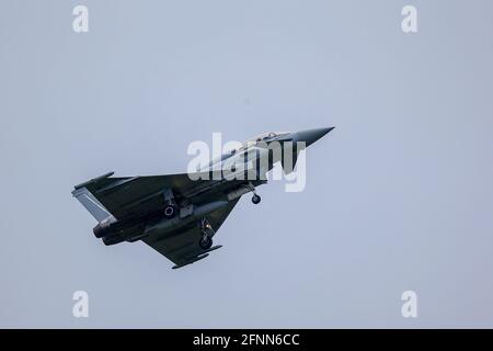 RAF Coningsby, Lincolnshire, UK. 18th May, 2021. An RAF Typhoon Eurofighter takes off from RAF Coningsby, Lincolnshire, on touch-and-go exercises. Credit: Peter Lopeman/Alamy Live News