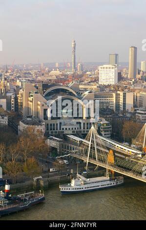 2007 London skyline from London Eye at sunset. Hungerford Bridge, Charing Cross station, River Thames from above. BT Tower towering over Stock Photo