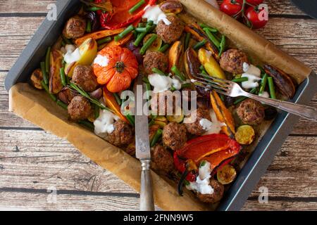 mediterranean oven dish with meatballs, vegetables and potatoes. Gluten free meal Stock Photo