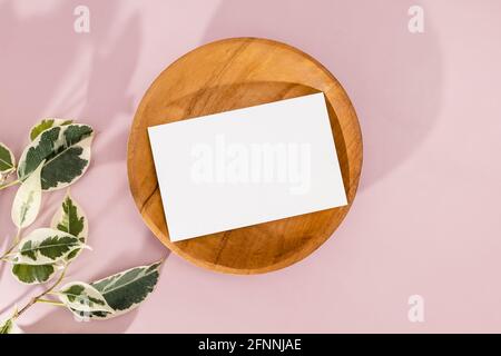 Business card mock-up on wooden plate Stock Photo