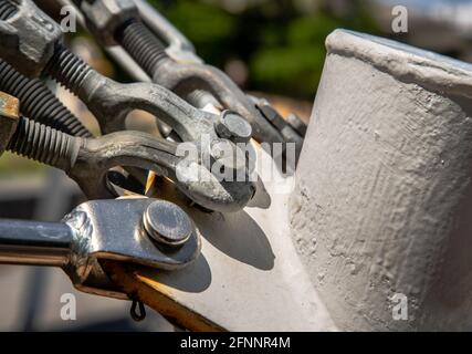 Detail of a boat turnbuckle for Wire Rope Sling. Steel turnbuckle, Fastening and Connections concept, Selective focus. Stock Photo