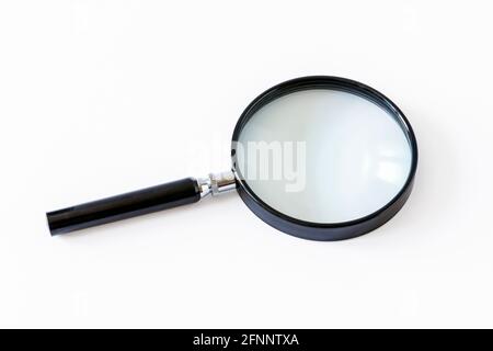 A black handheld magnifying glass isolated on a white background Stock Photo