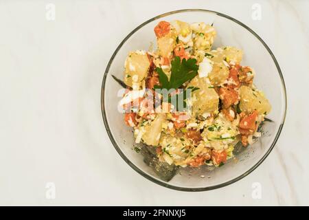 Delicious natural salad of cassava, carrot, egg with olive oil, ideal as a side dish. Natural nutrition concept. Stock Photo