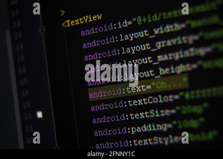 Android xml code on monitor screen from side Stock Photo