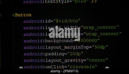 Android xml code on monitor screen in front Stock Photo