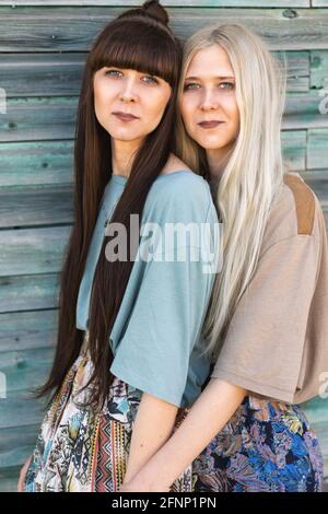 two beautiful twin girls doing style lying Stock Photo