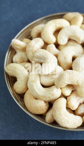 Close up picture of cashew nuts in a bowl, selective focus. Stock Photo