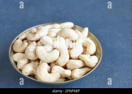 Cashew nuts in a bowl, selective focus. Stock Photo