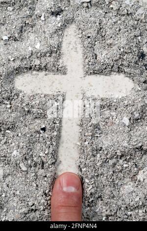 Cross made of ashes. Ash Wednesday. Lent season. France. Stock Photo