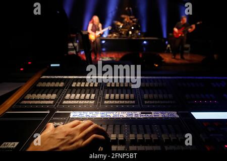 Rock and Roll band.  Professional sound mixing console for audio technician.   France. Stock Photo