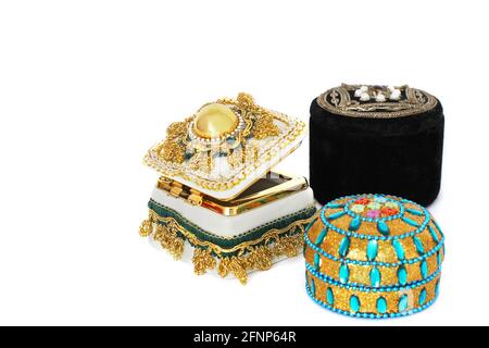 Jewelry Casket. Jewelry casket on a white background. Gold casket. Different jewelry caskets. Precious stones, velvet. Stock Photo