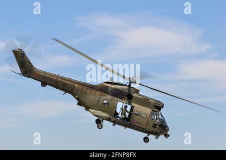 Royal Air Force, RAF, Puma HC.1 helicopter XW235 at Royal International Air Tattoo, RIAT, RAF Fairford, UK, with crewman at open door Stock Photo