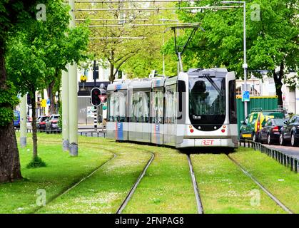 Rotterdam, Netherlands. 17th May, 2021. A tram runs next to the street Eendrachtsweg on rails in a green track bed. Credit: Soeren Stache/dpa-Zentralbild/dpa/Alamy Live News Stock Photo