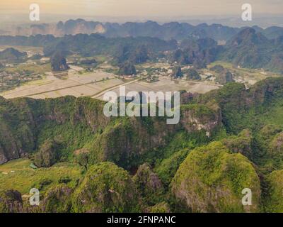 Majestic View Of Tam Coc Valley With Ngo Dong River Flowing Amid Rice  Paddies In Ninh Binh Vietnam High-Res Stock Photo - Getty Images