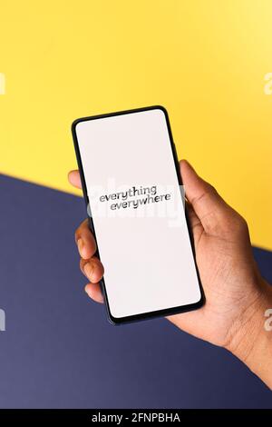 Assam, india - May 18, 2021 : Everything everywhere logo on phone screen stock image. Stock Photo