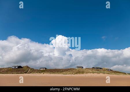 Head in the clouds, weather image from the beach at Newton by the sea Northumberland, UK. Stock Photo