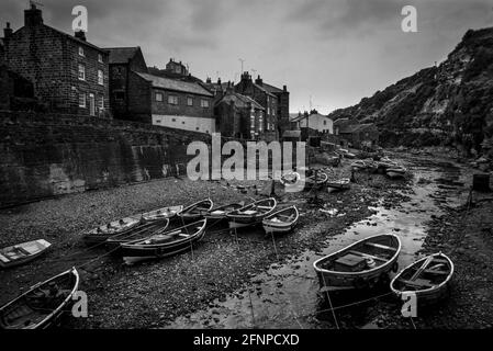 Staithes harbour with traditional cobble fishing boats Yorkshire 1979 Stock Photo