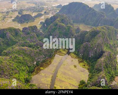 the majestic scenery on Ngo Dong river in Tam Coc Bich Dong view from drone in Ninh Binh province of Viet Nam Stock Photo