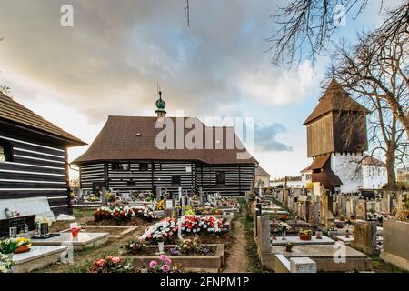 Old cemetery and wooden Church of St. John the Baptist with Renaissance bell tower built in 16th century in Slavonov village, Czech republic. Stock Photo