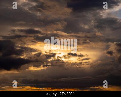 Color play of the clouds in the evening Stock Photo