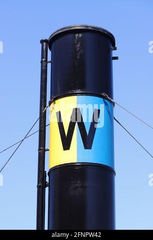 Stockholm, Sweden - May 12, 2021: View of the passenger shipping comapny Waxholmsbolaget logo on its steamship Storskar funnel in the Stockholm archip Stock Photo