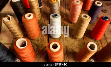 Skeins of thread. Sewing workshop. Multicolored threads. Stock Photo