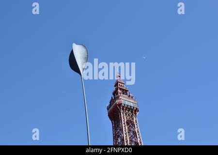 Blackpool Tower and Blackpool Promenade Sail with the moon aligned in the background Stock Photo