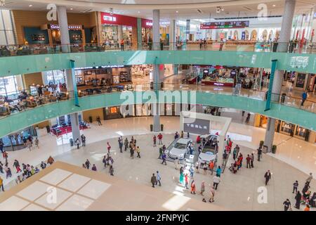 DUBAI, UAE - MARCH 12, 2017: Two Tesla cars exhibited in the Dubai Mall, one of the largest malls in the world. Stock Photo