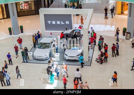 DUBAI, UAE - MARCH 12, 2017: Two Tesla cars exhibited in the Dubai Mall, one of the largest malls in the world. Stock Photo