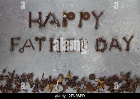 Word Father Day made of rusty hand tools which lie on a stone background Stock Photo