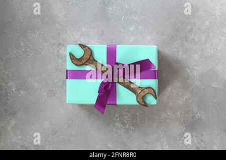 Craft gift with old tool on stone background. Fathers day concept. Flat lay Stock Photo