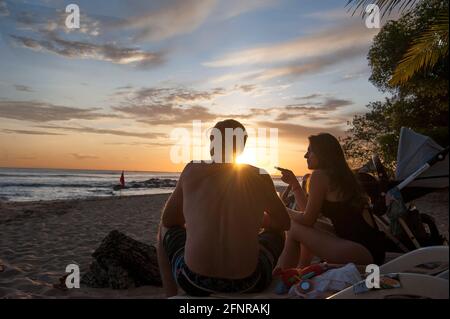 Couple enjoying the sunset in Costa Rica Stock Photo