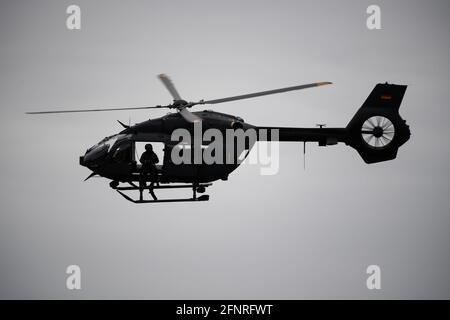 Calw, Germany. 10th May, 2021. A member of the German Armed Forces Special Forces Command (KSK) sits in an Air Force Special Forces helicopter. Credit: Marijan Murat/dpa/Alamy Live News Stock Photo