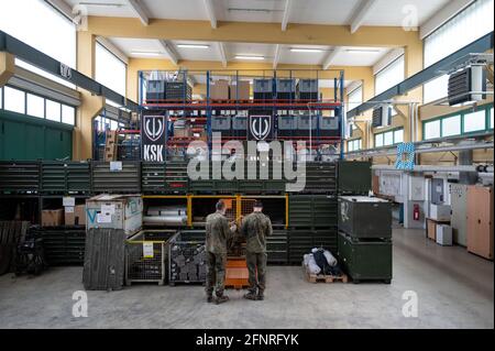 Calw, Germany. 10th May, 2021. Members of the support forces of the Bundeswehr Special Forces Command (KSK) stand in a material storage hall at the KSK site. Credit: Marijan Murat/dpa/Alamy Live News Stock Photo