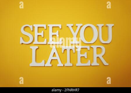 See You Later alphabet letter on yellow background Stock Photo