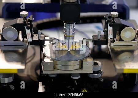 Silicon semiconductor wafer on RF probe station. Selective focus. Stock Photo