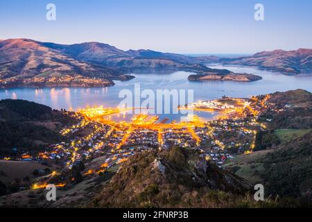 Lights of Lyttelton and Diamond Harbour at dawn, Lyttelton Harbour, Banks Peninsula, Canterbury, New Zealand Stock Photo