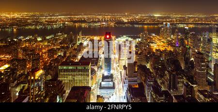 High View over Manhattan West and Pennsylvania Station at night, over Hudson River towards Jersey City. Stock Photo