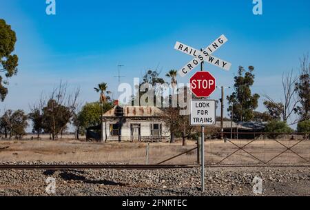 Abandoned house in rural Victoria. An abandoned house sits by a railway line in rural Victoria , Australia . Stock Photo