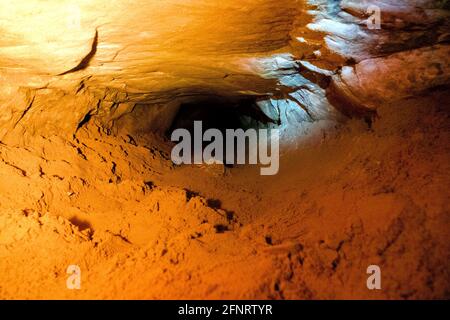 artificial cave under earth journey. wild cave, forgotten passages deep underground Stock Photo