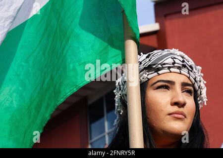 Columbus, United States. 18th May, 2021. Woman holds a Palestinian flag during the demonstration. Demonstrators gathered at the Ohio Statehouse to protest against Israel's occupation of Palestine. (Photo by Stephen Zenner/SOPA Images/Sipa USA) Credit: Sipa USA/Alamy Live News Stock Photo