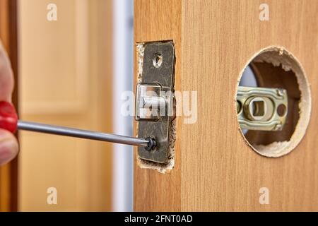Diy door lock renovation in living room. Stock Photo