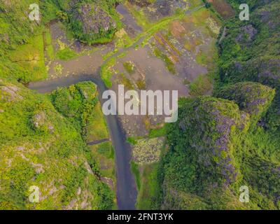 the majestic scenery on Ngo Dong river in Tam Coc Bich Dong view from drone in Ninh Binh province of Viet Nam Stock Photo