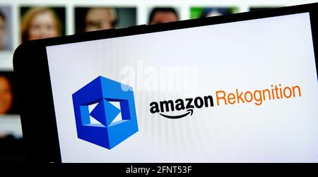 Amazon Rekognition AWS platform logo on smartphone and blurred faces on ...
