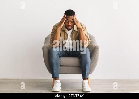 Concerned African American Guy Thinking Worrying About Problems, Gray Background Stock Photo