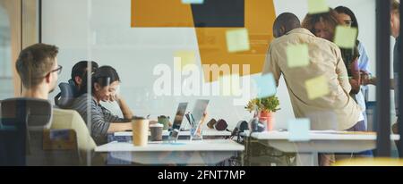 Young professionals working on task solution together Stock Photo