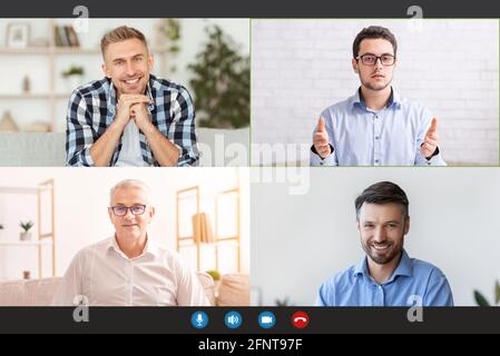 Monitor screen with cheerful men having group video chat, speaking to each other via internet Stock Photo