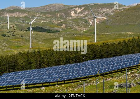 Solar panels and wind turbines for the production of renewable and low-polluting energy. Collarmele, province of L'Aquila, Abruzzo, Italy, Europe Stock Photo