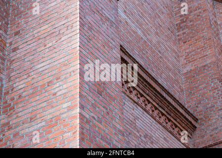 Fragment red brick wall catholic church nice background. Stock Photo