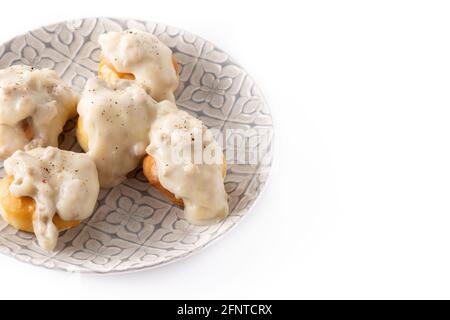 Traditional American biscuits and gravy for breakfast isolated on white background Stock Photo
